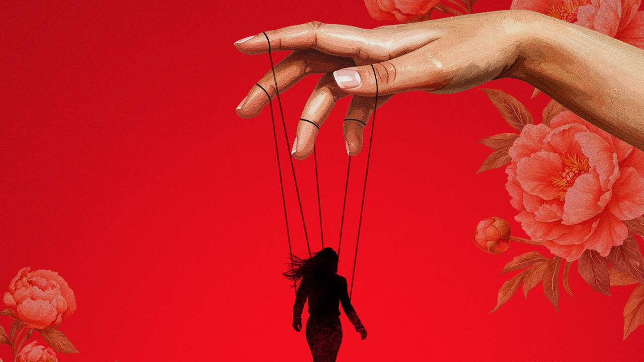 a hand with a woman on puppet strings